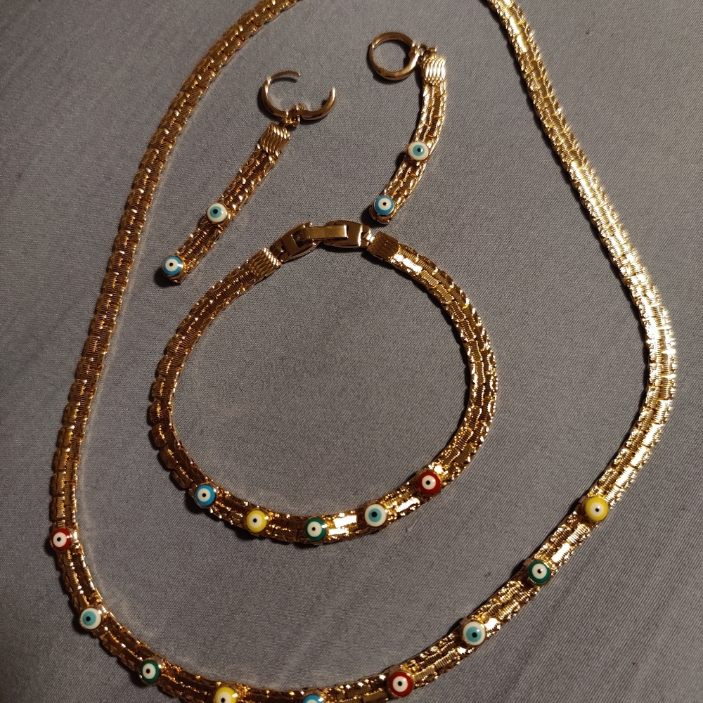 Gold plated evil eye set.